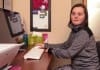 Jenna at her desk at home