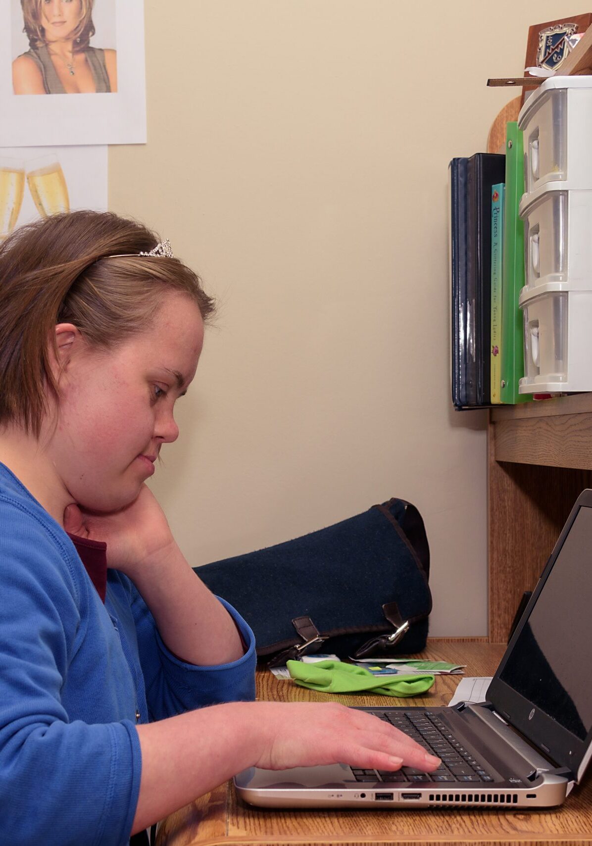Here is Sofia sitting in her room at her desk. Working on a computer.